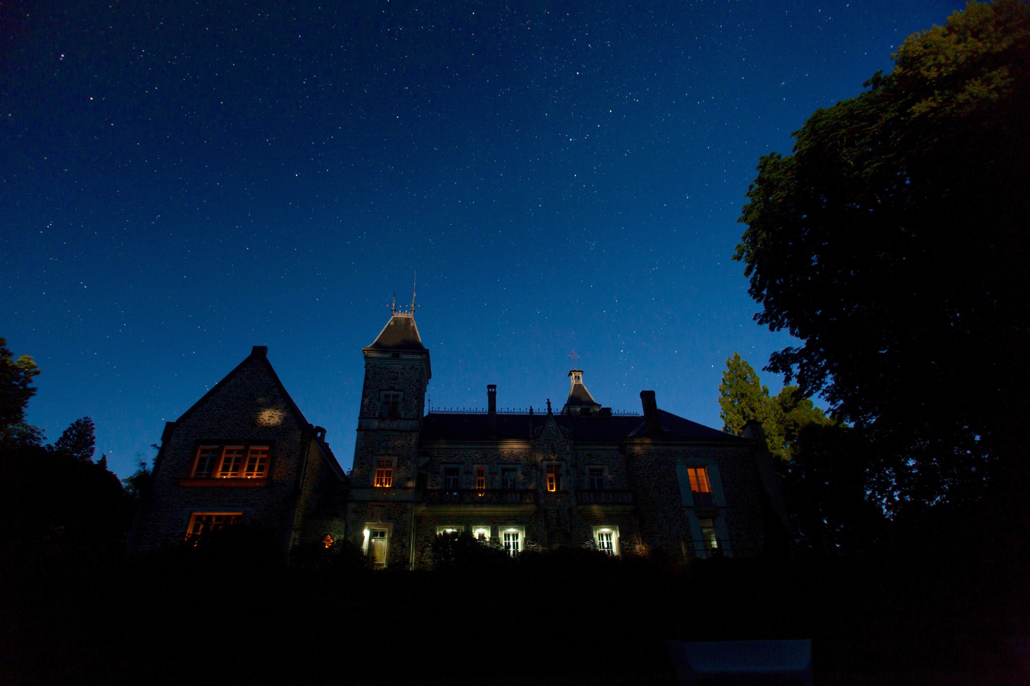 Château d’Oche beneath a star-filled night sky
