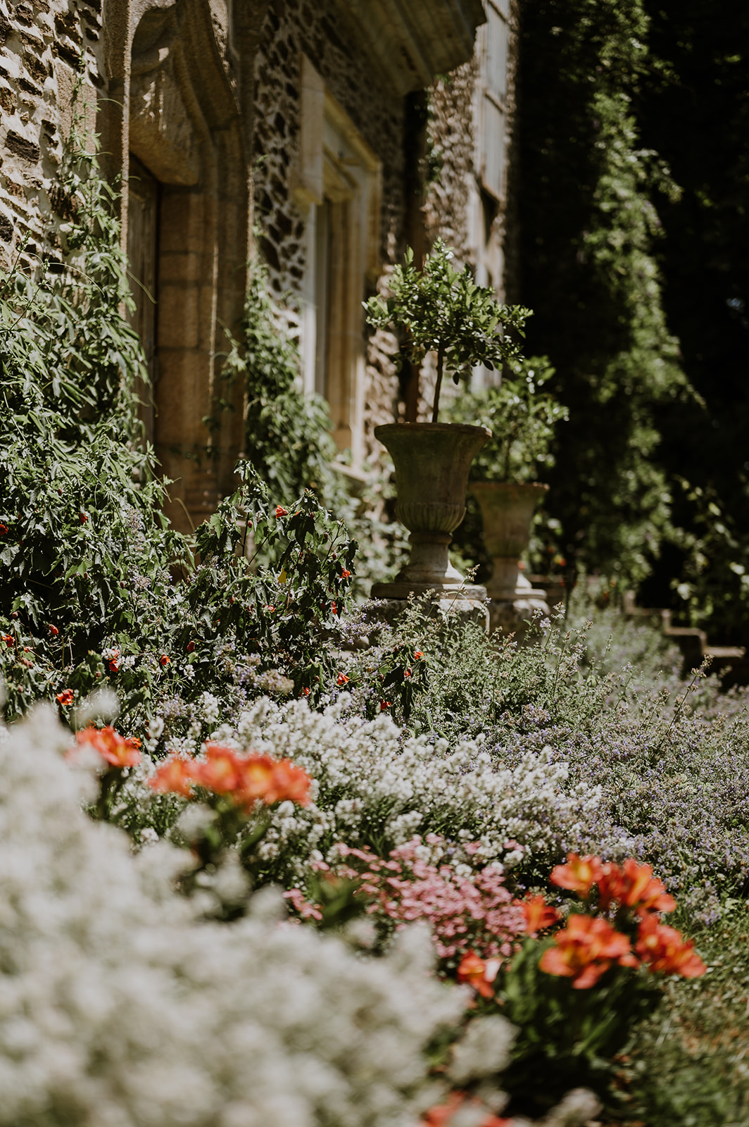Flower-filled garden beside the château façade
