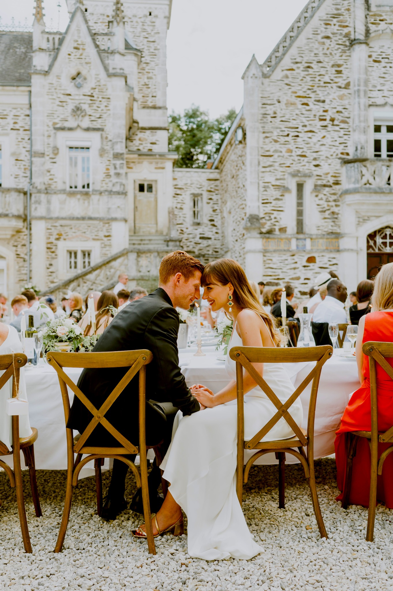 A quiet moment between bride and groom during their courtyard reception