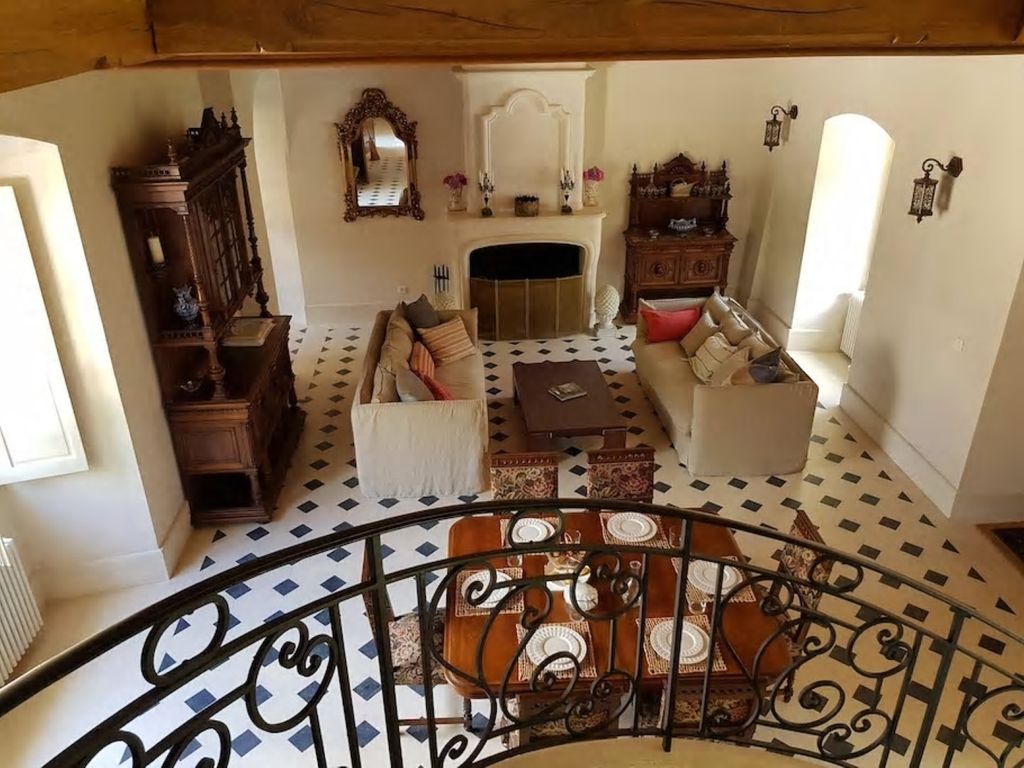 Living and dining space viewed from the château staircase